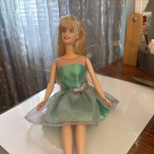 Elegant Doll in Teal Dress with Silver Accents